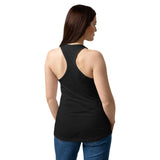 Woman wearing a black tank top and blue jeans on a white background