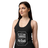 A woman wearing a black racerback tank top with a white graphic print that reads 'Better Living Through Potions'  against a plain white background.
