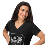 A woman with dark hair smiling while wearing a black V-neck t-shirt with a white graphic that reads 'BETTER LIVING THROUGH POTIONS.