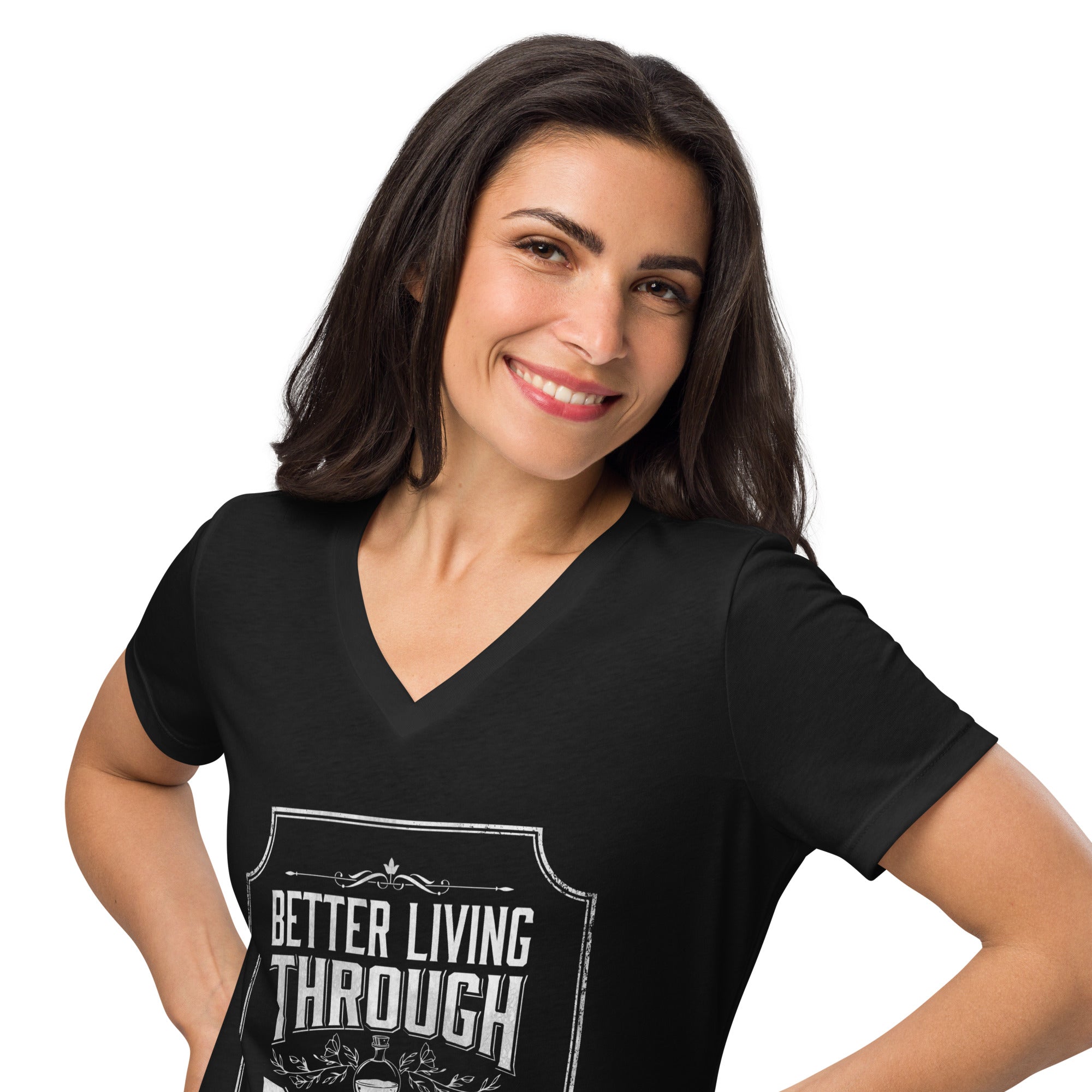 A woman with dark hair smiling while wearing a black V-neck t-shirt with a white graphic that reads 'BETTER LIVING THROUGH POTIONS.