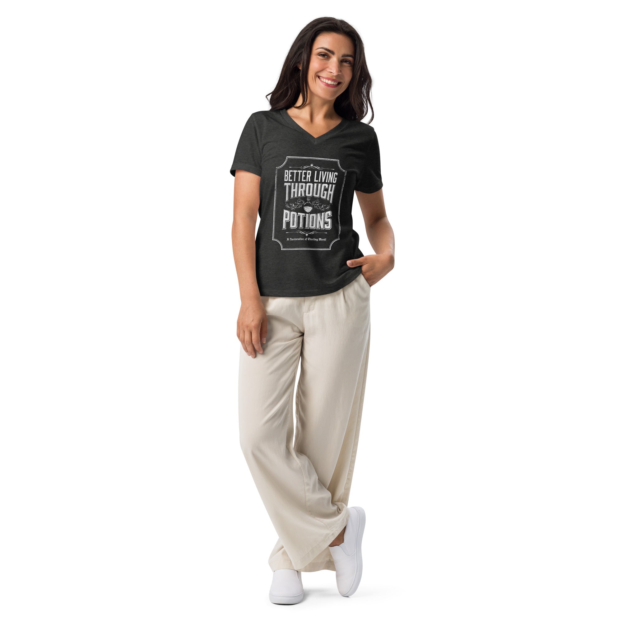 woman wearing a heather grey vneck tshirt with better living through potions design on it