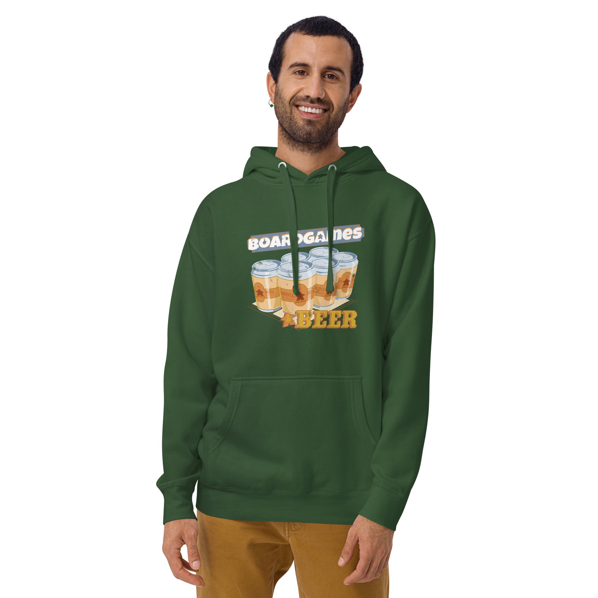 A man wearing a forest green pullover hoodie with a graphic 6 beer cans and the words Boardgames and beer