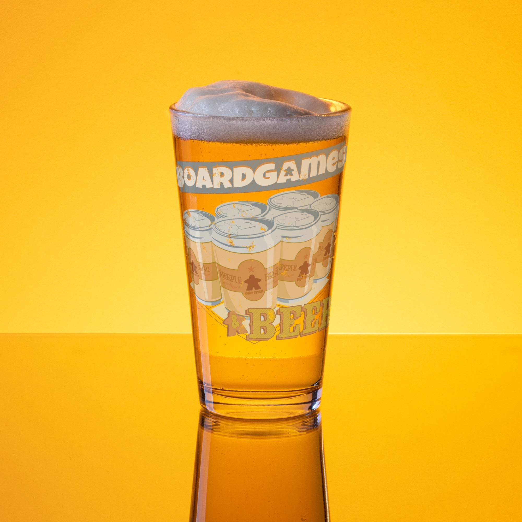 16-ounce glass pint glass printed with "Boardgames & Beer" text above an illustration of a six-pack of beer cans.