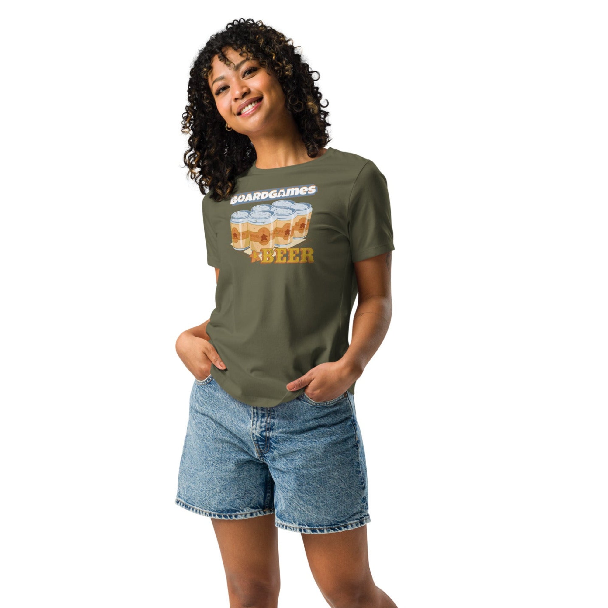 Woman with curly hair wearing green t-shirt with our board games and beer design on it