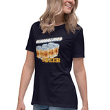 A woman wearing a navy blue graphic t-shirt with a 'Boardgames & Beer' design featuring illustrated beer cans, paired with blue jeans, against a plain white background.