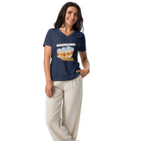 woman wearing navy vneck board games and beer t-shirt with white pants.