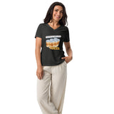 Woman wearing a heather grey vneck t-shirt with board games and beer design on it.
