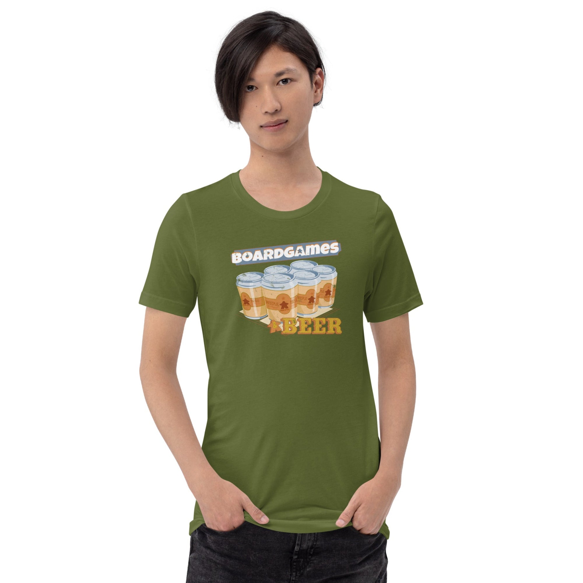 A model wearing an olive green t-shirt with a graphic that reads 'BOARDGAMES' above six cans beer cans, paired with dark jeans against a plain white background.