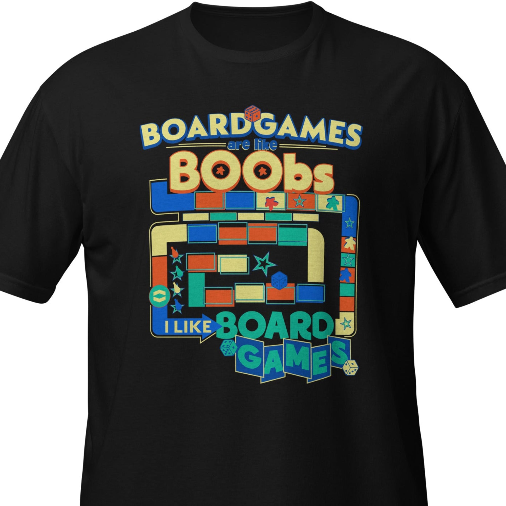A black short-sleeve crewneck t-shirt with a colorful graphic on the chest that reads 'BOARD GAMES ARE LIKE BOOBOS' and 'I LIKE BOARD GAMES' in playful multicolored design