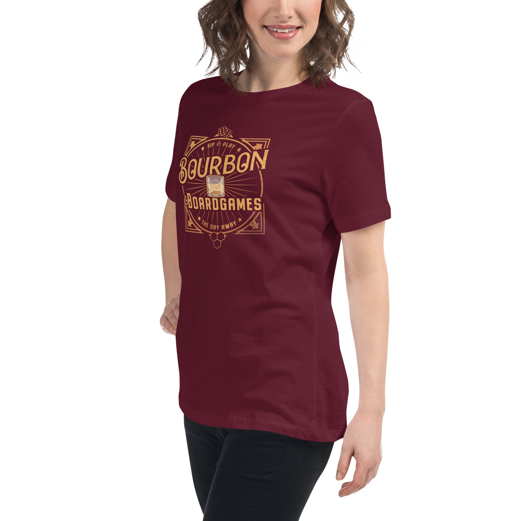 A woman wearing a red t-shirt with our bourbon and board games design printed on it