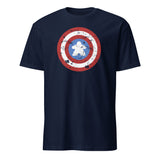 A navy blue short-sleeve crewneck t-shirt featuring a distressed shield graphic on the chest with a meeple at the center, set against a plain white background.