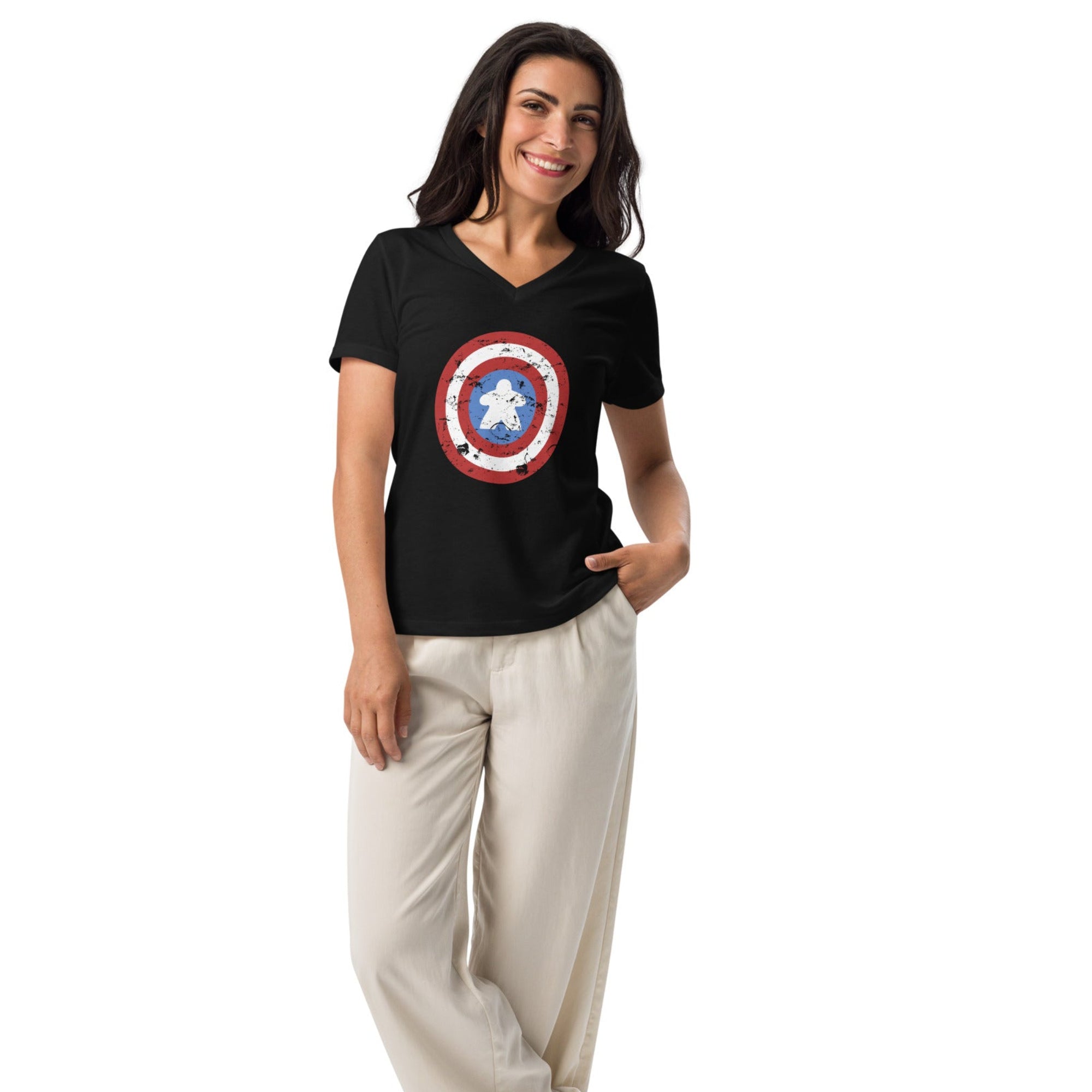 Woman wearing a black t-shirt with captain meeple shield on a white background