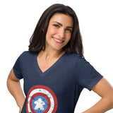 A woman with dark hair smiling and posing in a heather navy blue v-neck t-shirt featuring a distressed Captain Meeple shield graphic on the front, set against a plain white background.
