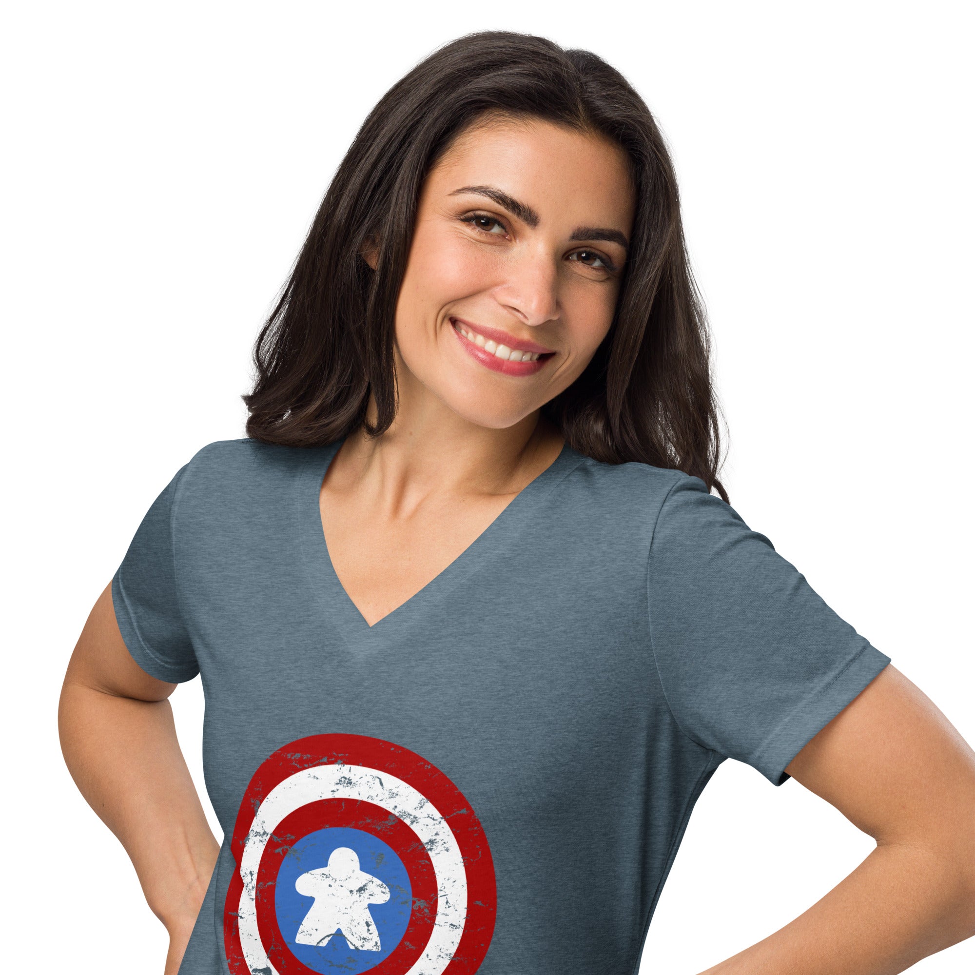 A woman wearing a heathered slate blue v-neck t-shirt with a distressed Captain meeple shield graphic on the front, set against a plain white background.