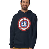 A pullover hoodie printed with a red, white, and blue shield design featuring a  meeple at its center in place of a star.