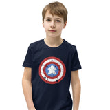 A youth-sized t-shirt printed with a red, white, and blue shield design featuring a wooden meeple at its center in place of a star.