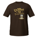 A dark brown short-sleeve t-shirt with a graphic on the chest that reads 'Coffee and Board Games' in a gold textured font, above an illustration of a coffee cup with a meeple on it.