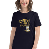 A woman wearing a navy blue short-sleeve t-shirt with a gold graphic that reads 'Coffee and Board Games' with a small coffee cup illustration, set against a plain white background.