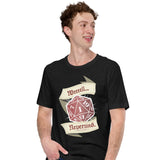 A man wearing a black graphic t-shirt with a red and beige 20-sided die design and the text 'Weeeell... Nevermind'