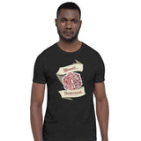 A man wearing a dark charcoal heather t-shirt with a graphic of a 20-sided d20 die showing a 1, framed by banners that read 'Weeeell... Nevermind'
