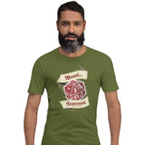 A man wearing an olive green t-shirt with a red D20 showing a natural 1 graphic print that reads 'Weeeell... Nevermind'