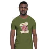 A man wearing an olive green t-shirt with a red D20 showing a natural 1 graphic print that reads 'Weeeell... Shit.'