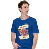 A man wearing a royal blue t-shirt with a graphic of a red 20-sided die and banners reading 'Weeeell... Shit.'